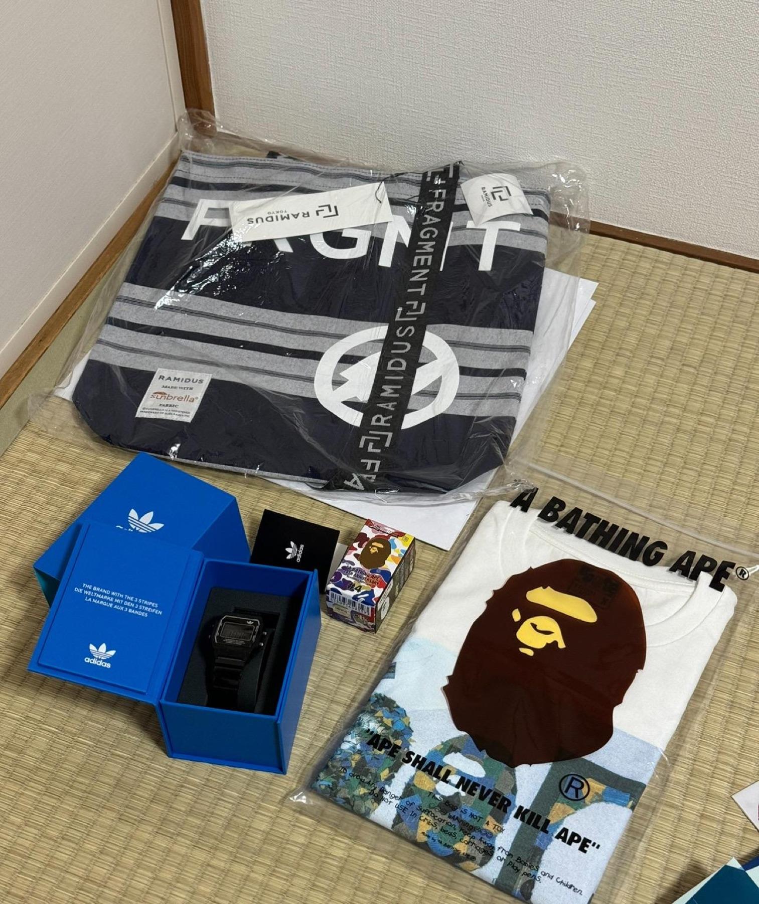 Fragment x Ramidus striped tote in plastic, adidas Originals digital watch in blue box, BAPE tee