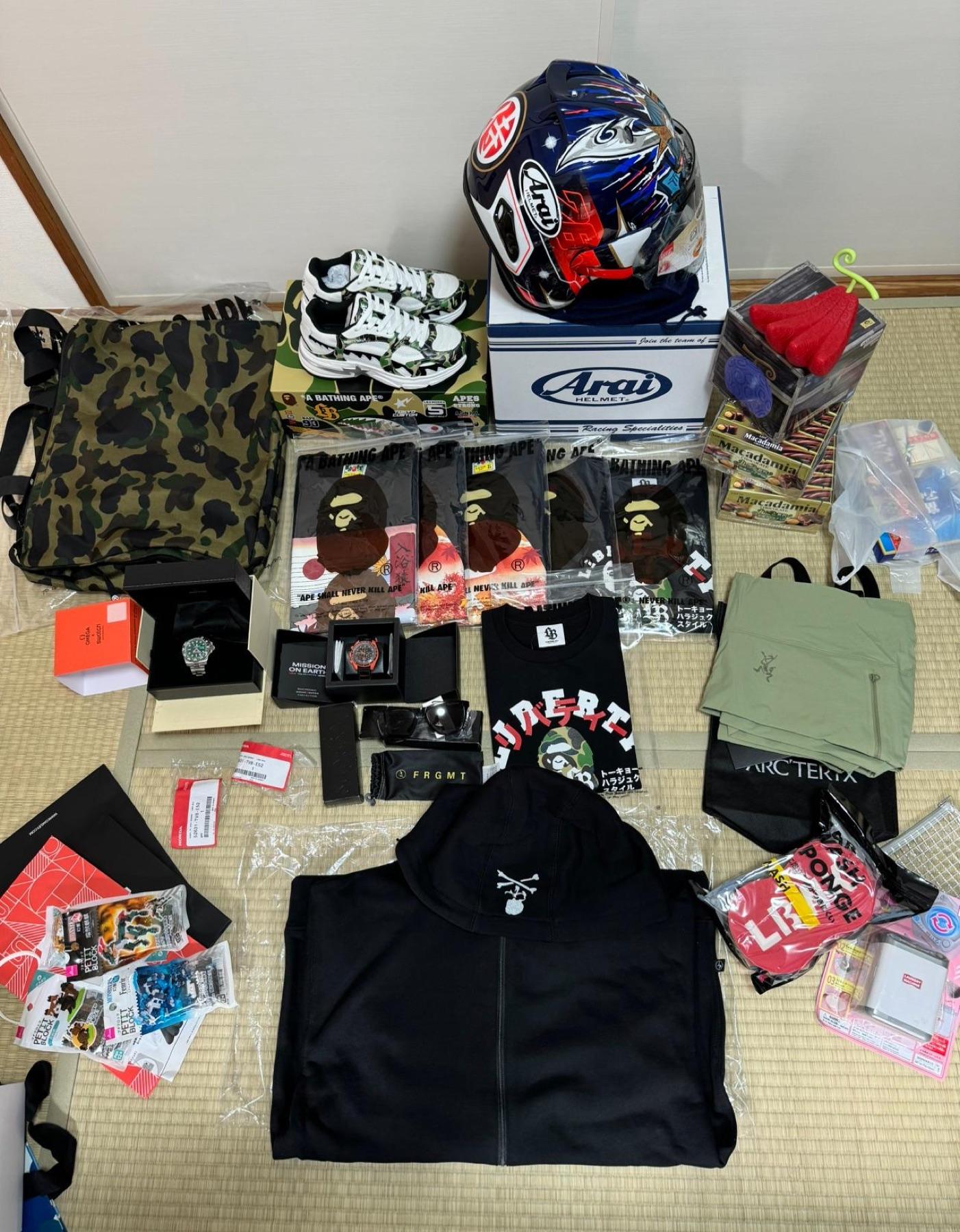 Arai graphic helmet, BAPE camo sneakers and bag, five BAPE tees, Omega x Swatch, Arc'teryx, Mastermind hoodie, Fragment sunglasses
