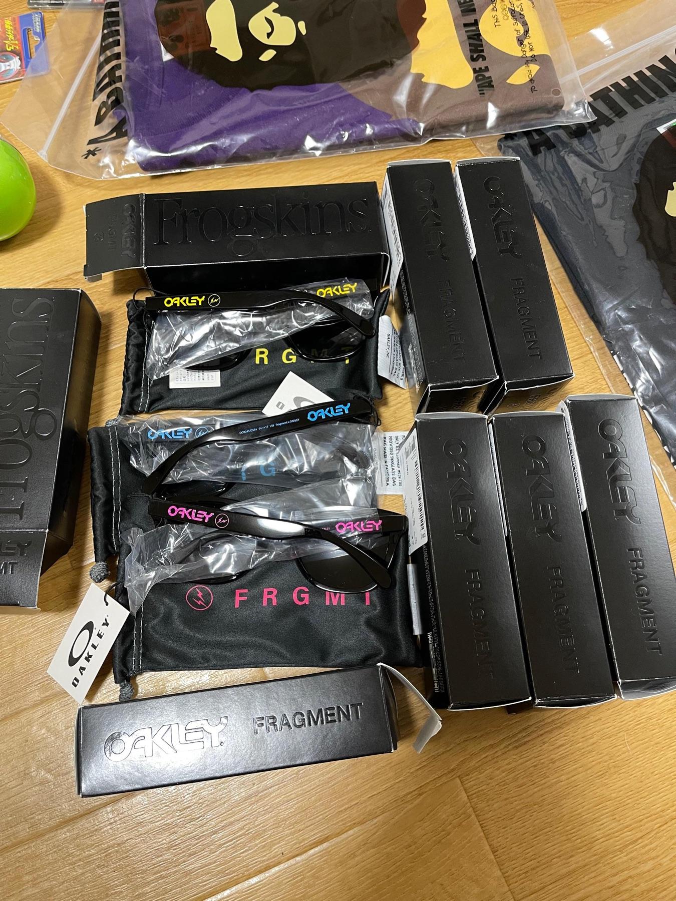Oakley x Fragment Frogskins sunglasses in yellow, blue and pink logo variants with black boxes