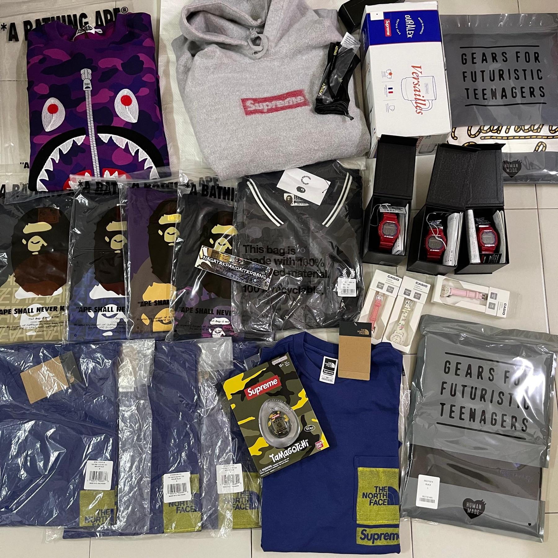 BAPE purple camo shark hoodie, Supreme grey box logo hoodie, red G-Shock watches, Casio watches, TNF x Supreme tees and Human Made bags