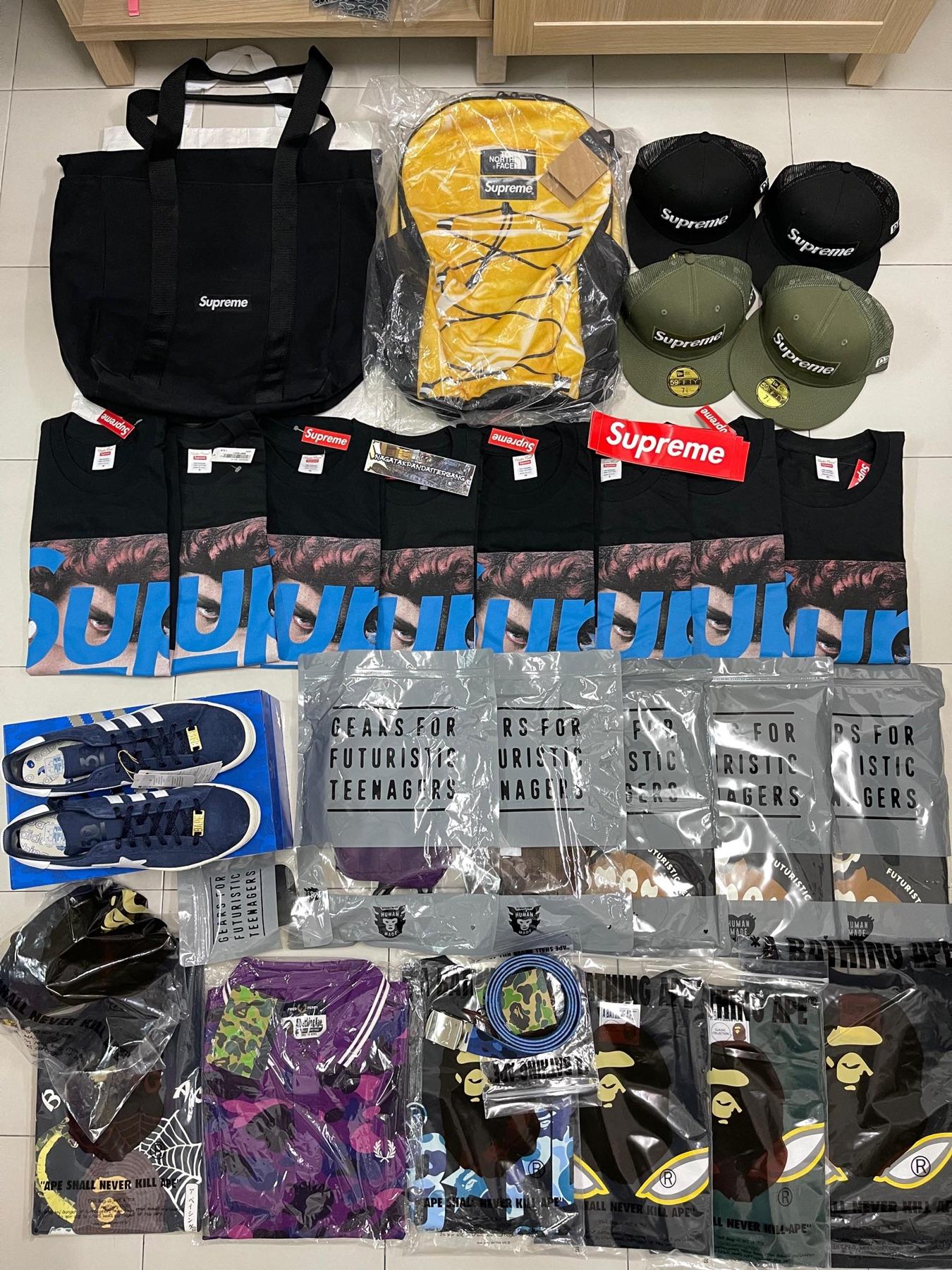 Supreme black tote, yellow TNF x Supreme backpack, Supreme New Era caps, seven Supreme Undercover tees, adidas Campus and Human Made bags